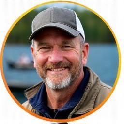 Headshot of Mark Henderson holding a fishing lure.